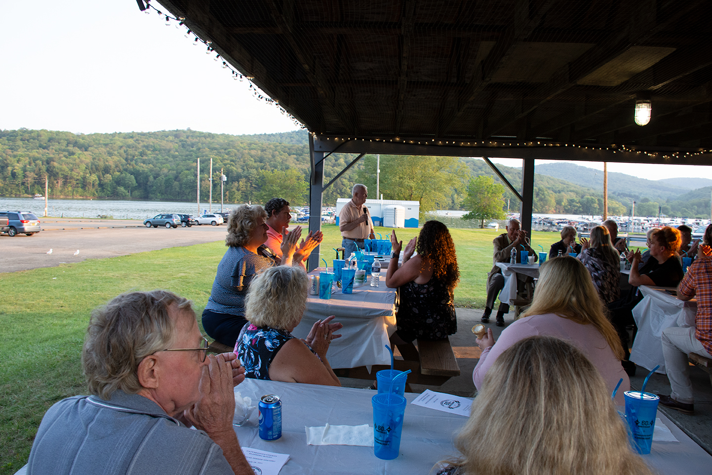 Attendees applause after Chuck Couture announced that Paul Bishop is the recipient of the Brooks Patterson Award