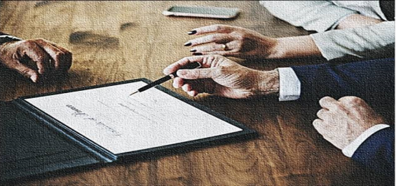 hands of two men and a women near an official document