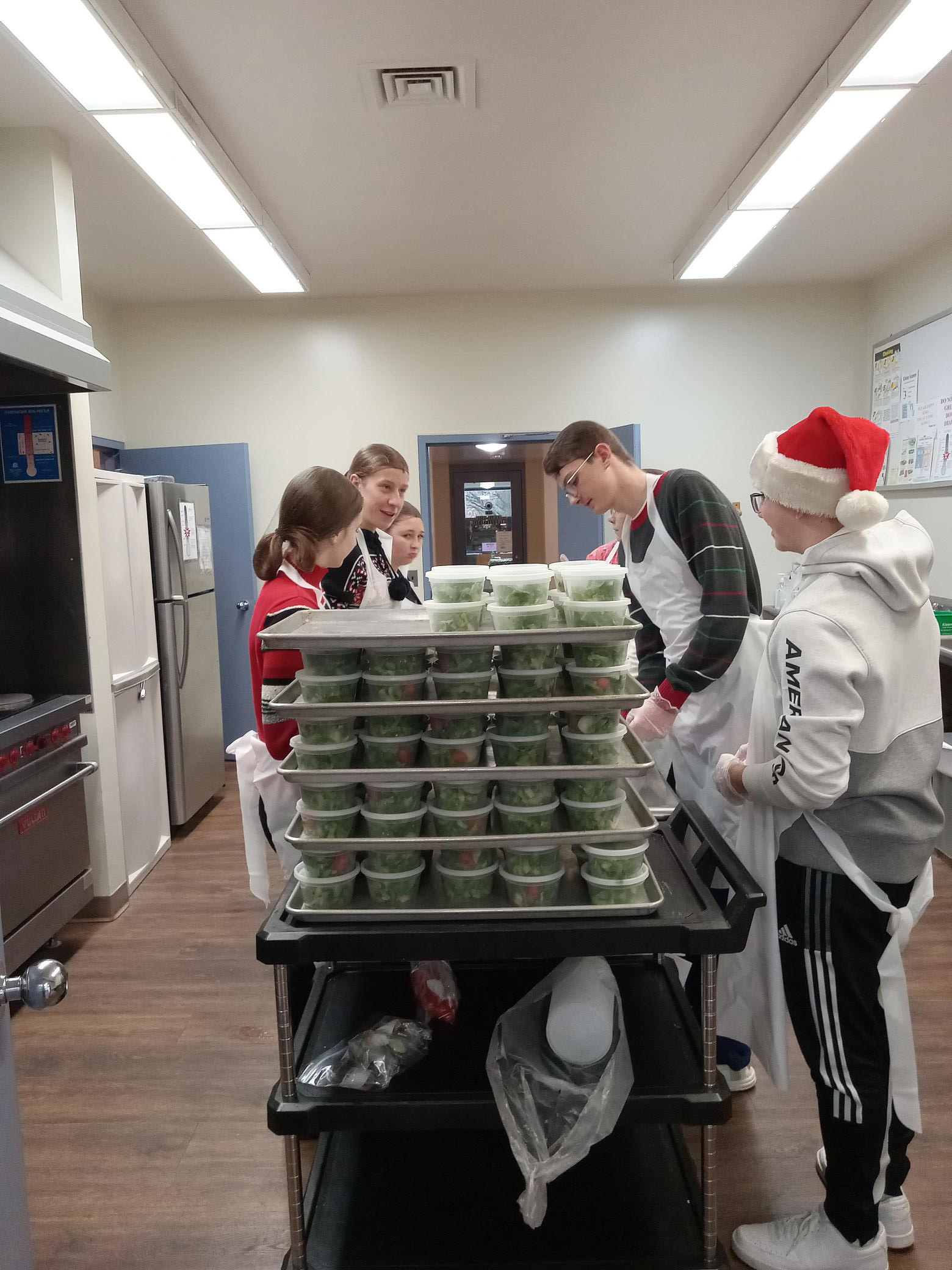 Government interns packaging meals for senior citizens