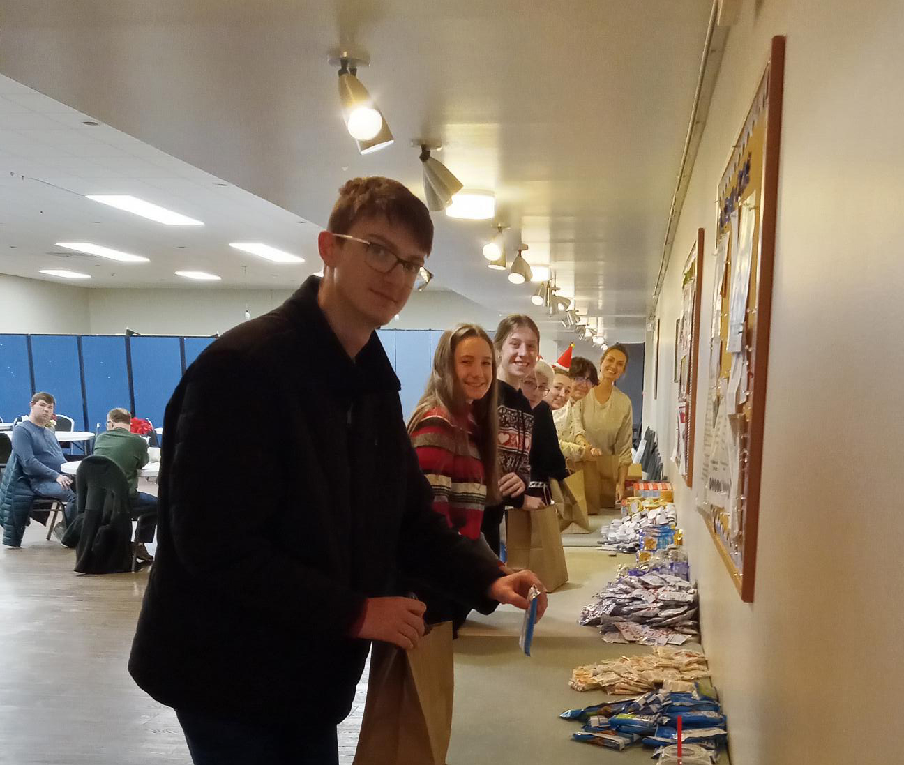 Government interns packing snack bags for Senior citizens