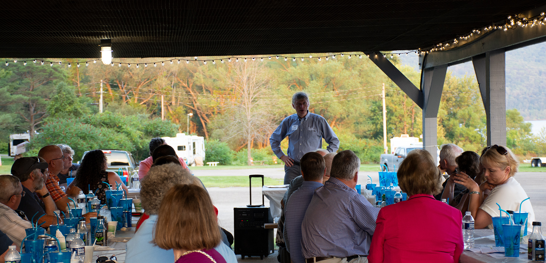 With the Allegheny Reservoir in the background, Jon Sundquist talking about the development of trails in Catt. County