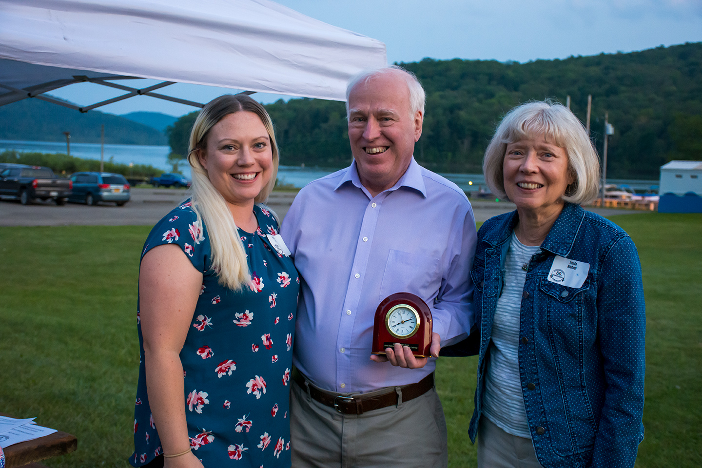 Paul Bishop with Brooks Patterson award, daughter Maddie and wife Linda