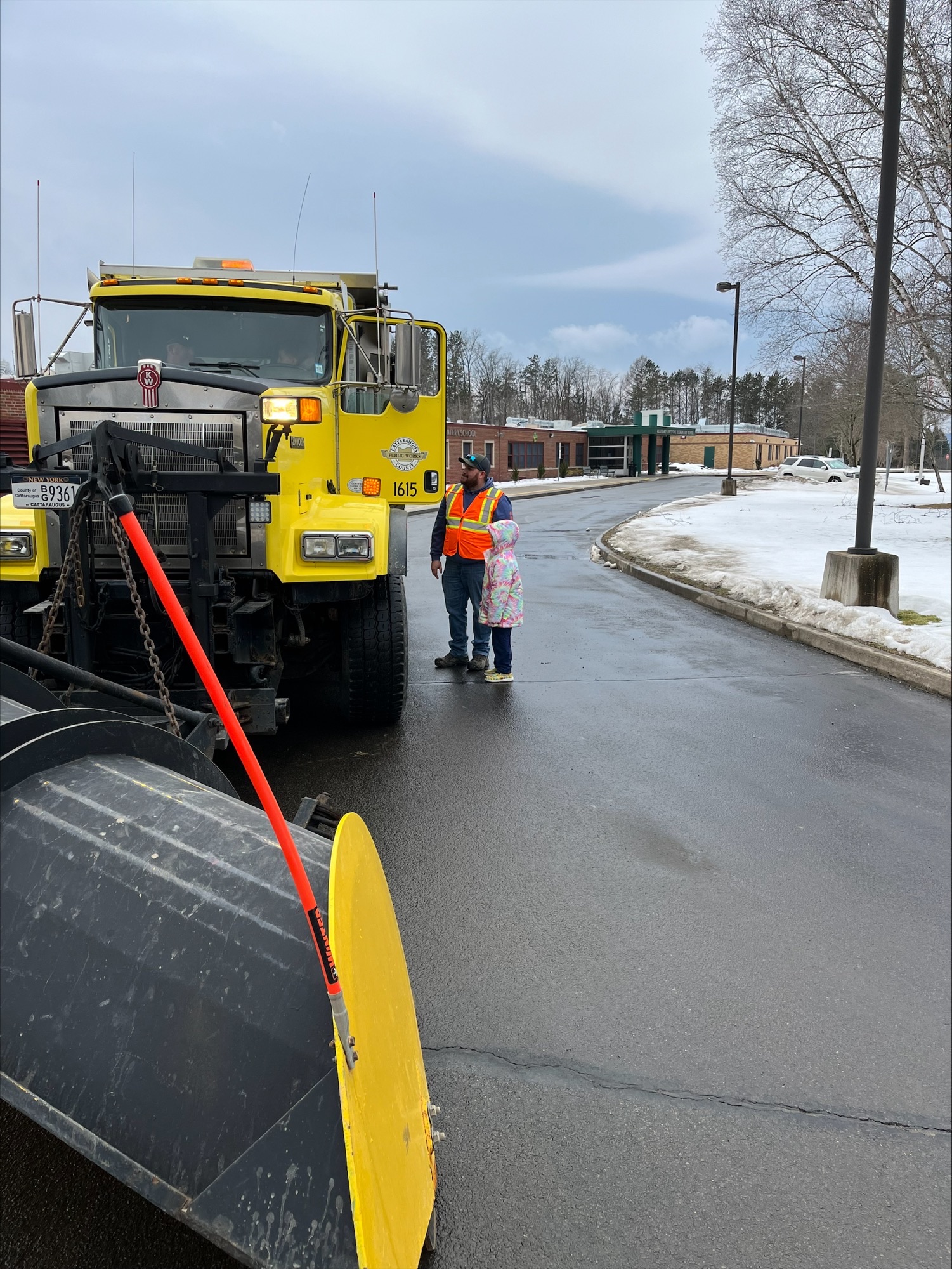 Student and employee looking at the inside of a truck