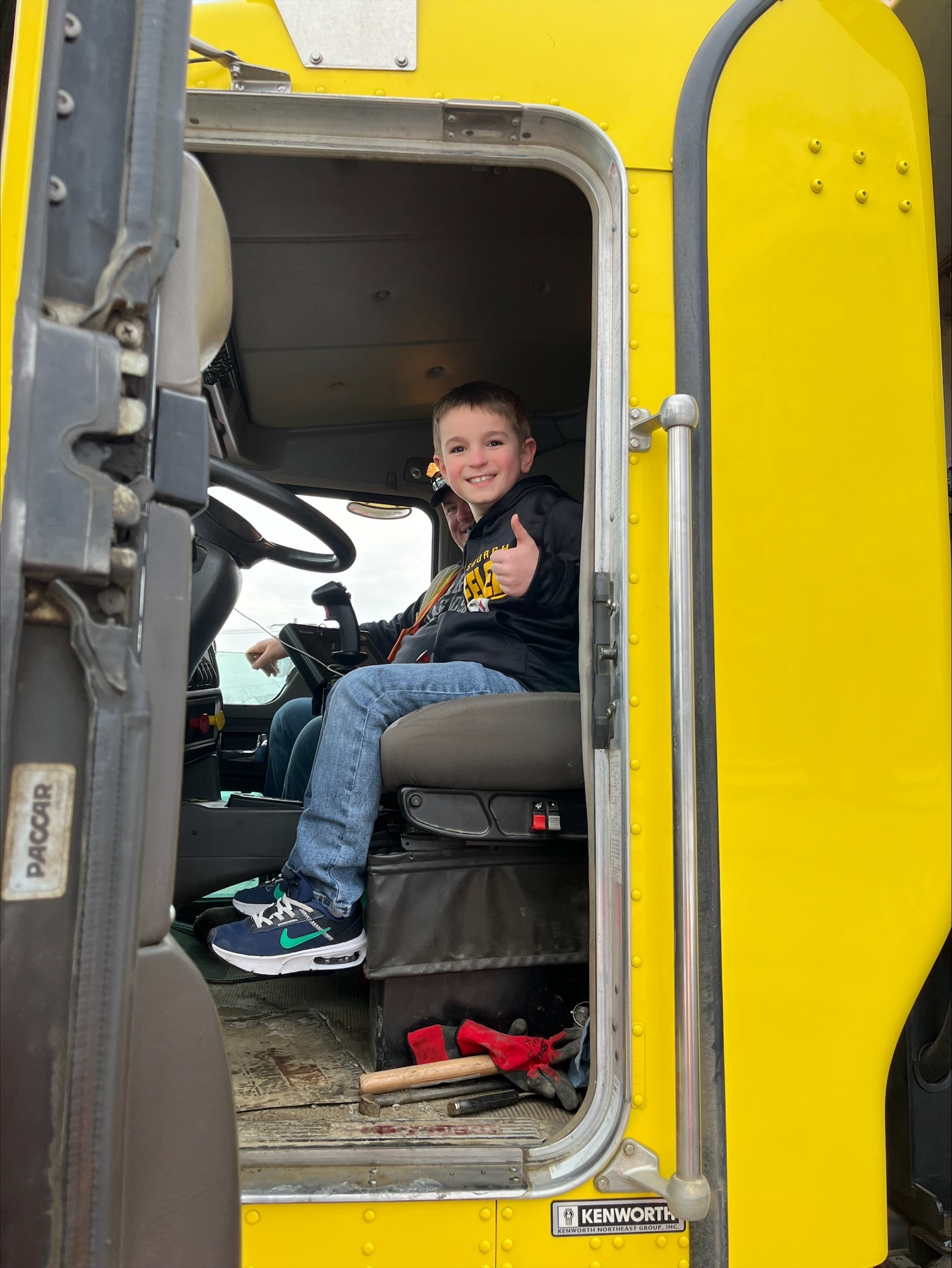 A student smiles while sitting in a Cattaraugus County truck